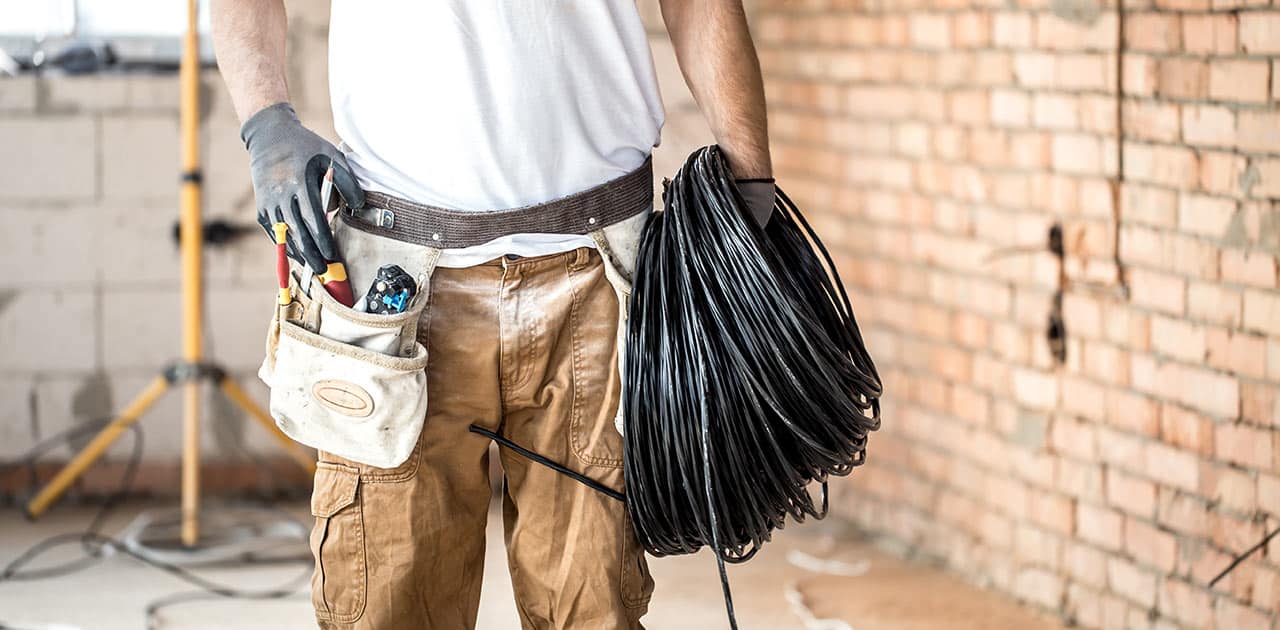 What tools are needed to pull wires through an electrical conduit?